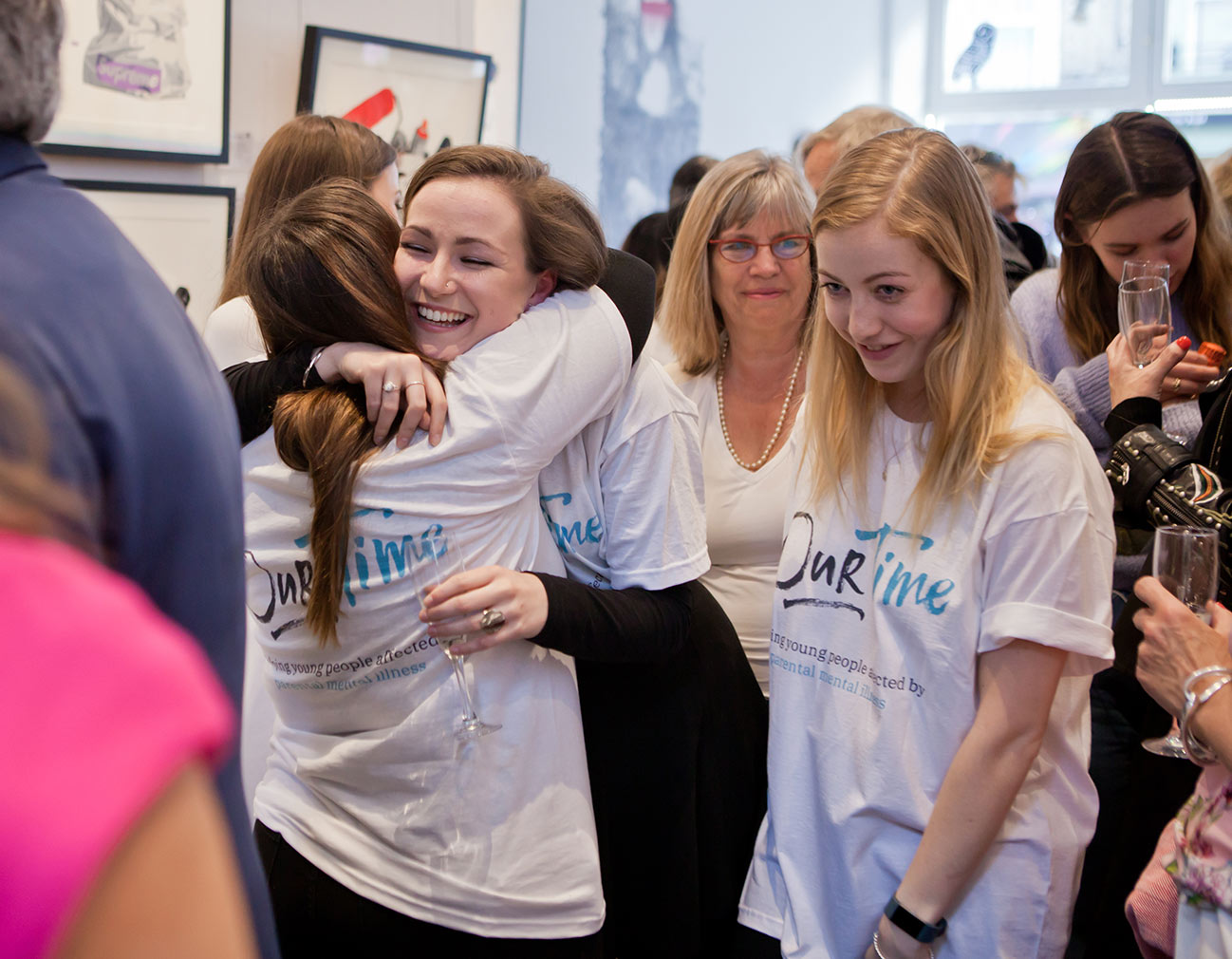 A group of Our Time Charities beneficiaries celebrating